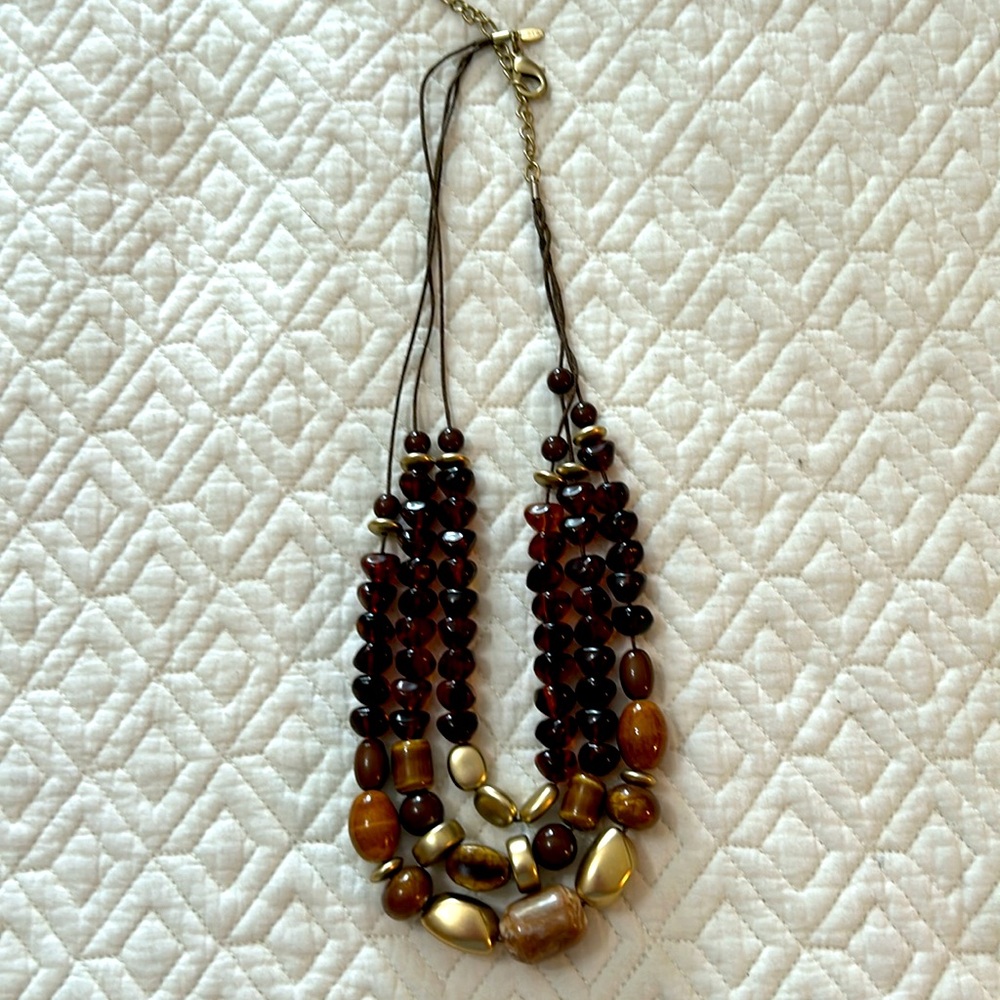 Chico’s three strand necklace with gold and various shades of brown beads. - Picture 3 of 4